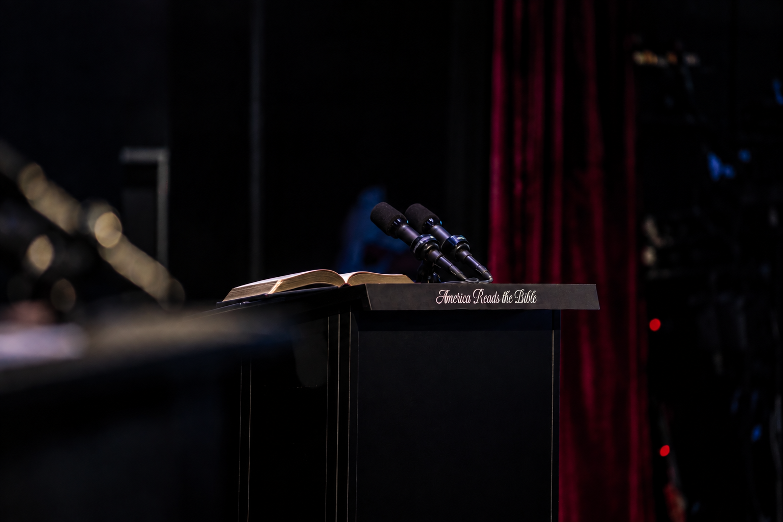 Bible and microphones on the America Reads the Bible stage lectern